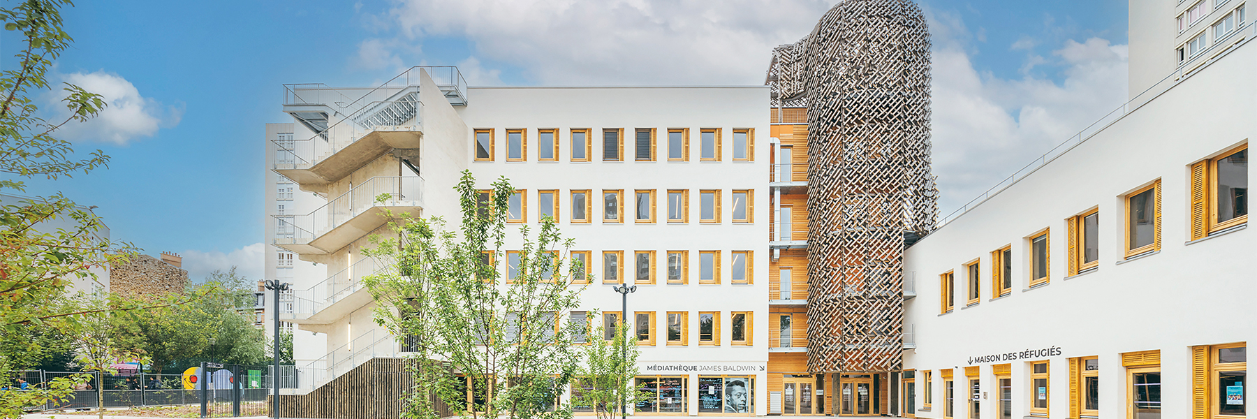 Bannière bâtiment comprenant la médiathèque James Baldwin et la maison des réfugiés attenante